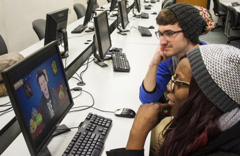 Biology majors Connor Cheek and Maite Miller watch Youtube videos during study breaks.
