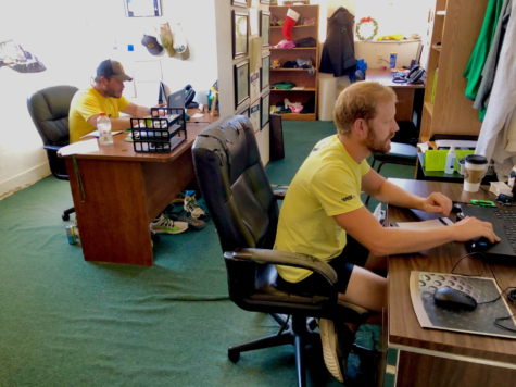 USAO assistant soccer coaches Tony Orsi, left and Niall Crick, right looking at the schedule for the busy week ahead. 