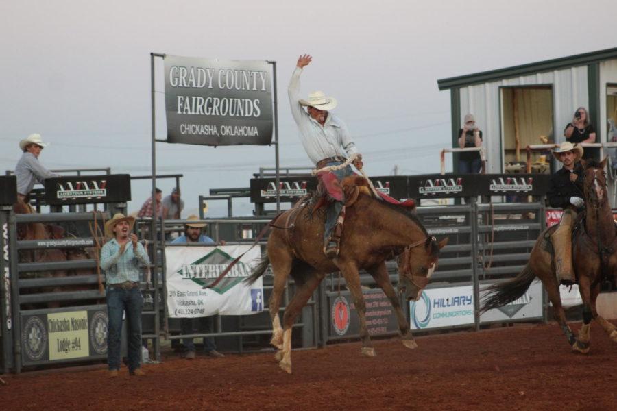 The bucking broncho fought hard to toss the cowboy off its back at the Chickasha Rodeo. Photo captured by Mary Grace McNutt.
