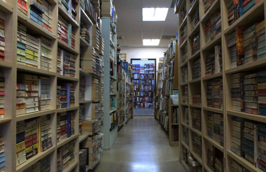 At the Bookstore on the Corner the shelves are stacked high with books of all genres. 