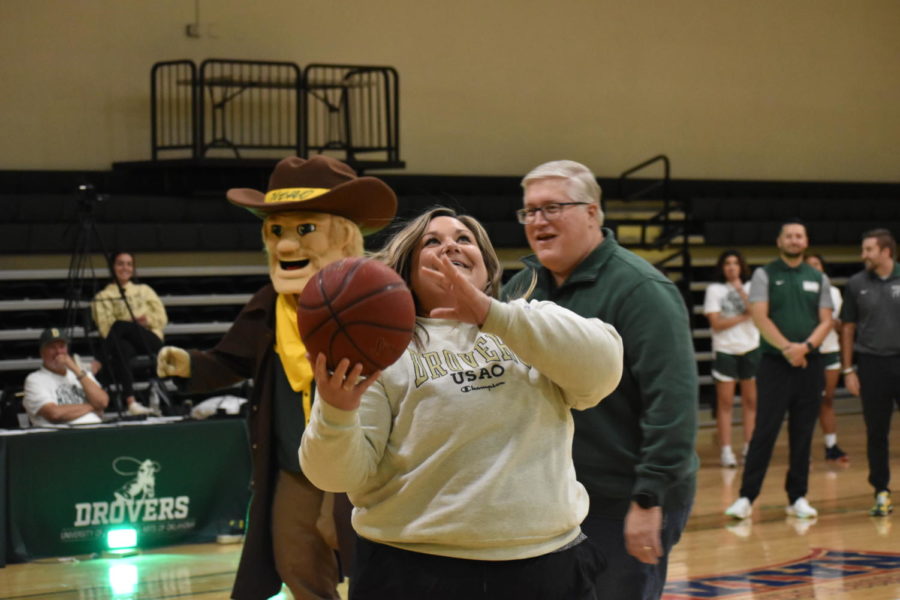 Andrea Freymiller, one of USAO’s athletic trainers, grins as she goes up for another shot at Drover Madness. 