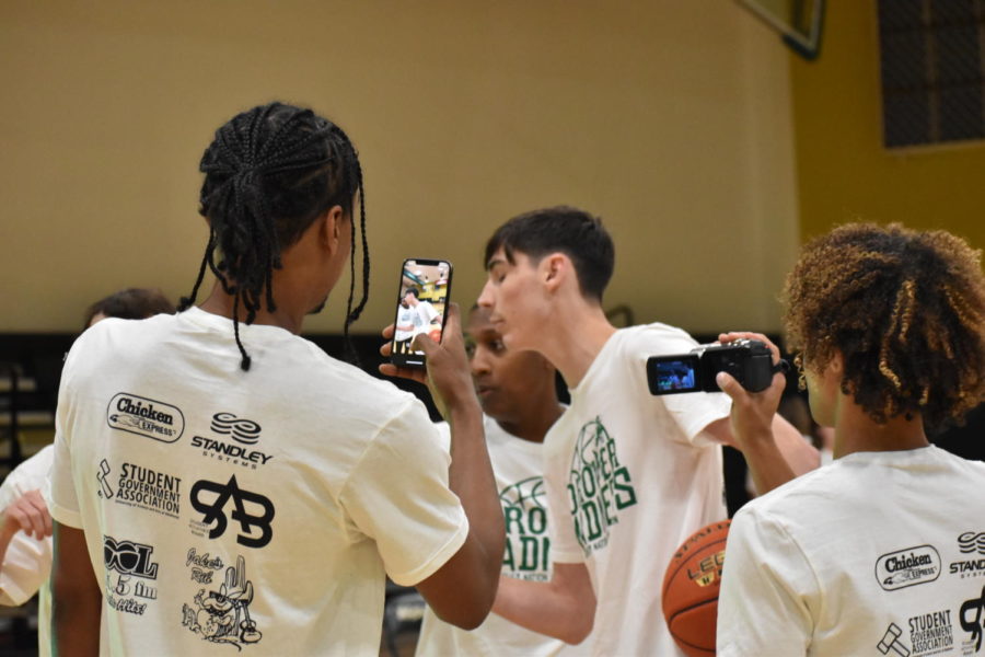 Jaden Harrell and Gerard Mukuntae tried to interview Logan Dolan before the 3-point contest began. 
