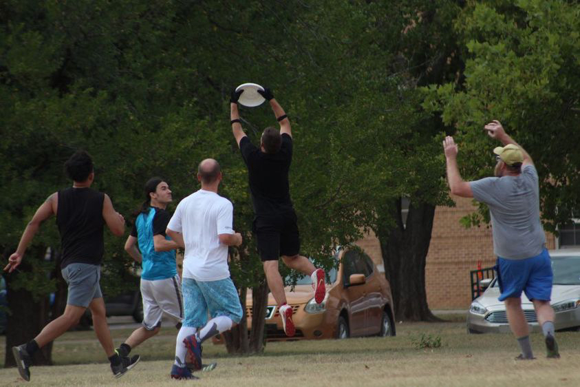 Faculty and students gather together to get active and have fun through ultimate frisbee.