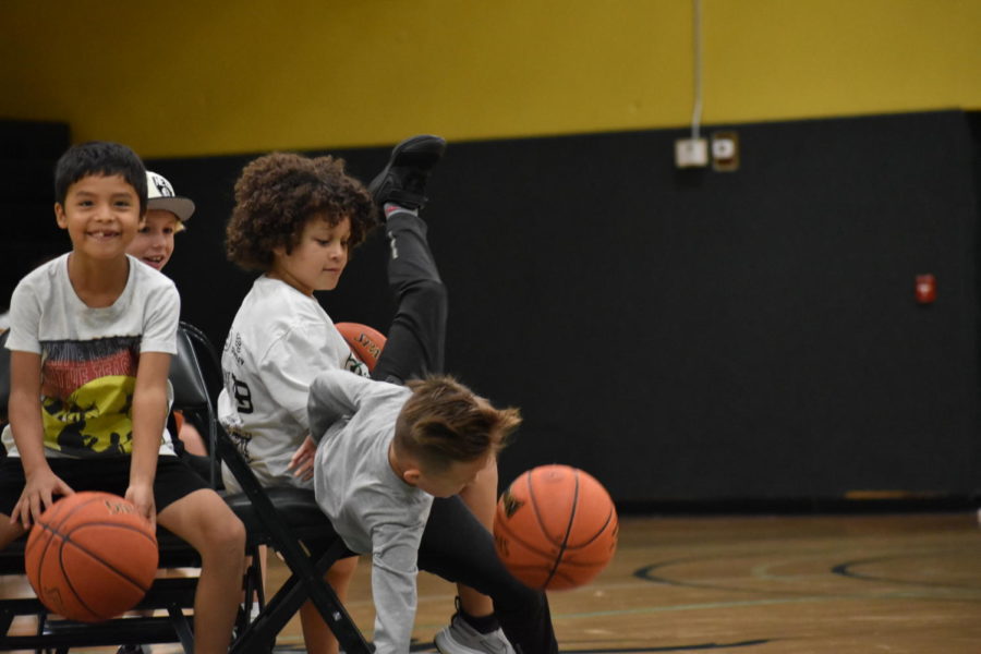 Two young players collided when they both sought the same chair in musical chairs at Drover Madness!