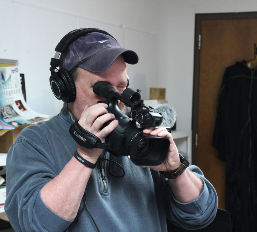 David Duncan, instructor of digital media technology, peers through his camera in anticipation for the Movie Pre-Production class this spring.