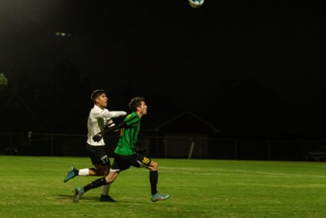 USAO sophomore forward #16 Darko Borinsavljevic competes with a  MACU defender in order to control the ball.