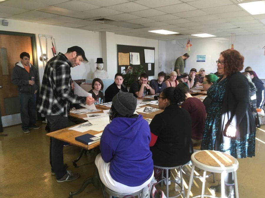 Pixar's Jay Shuster explains a drawing in detail with an early morning master class of USAO students.