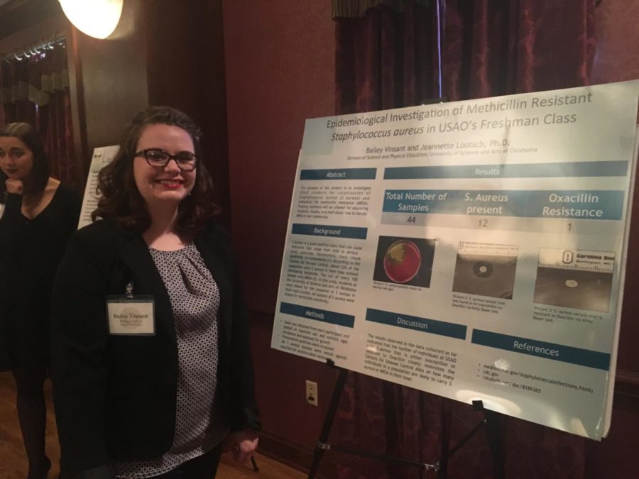 Students answer questions about their research projects at the Student Showcase.