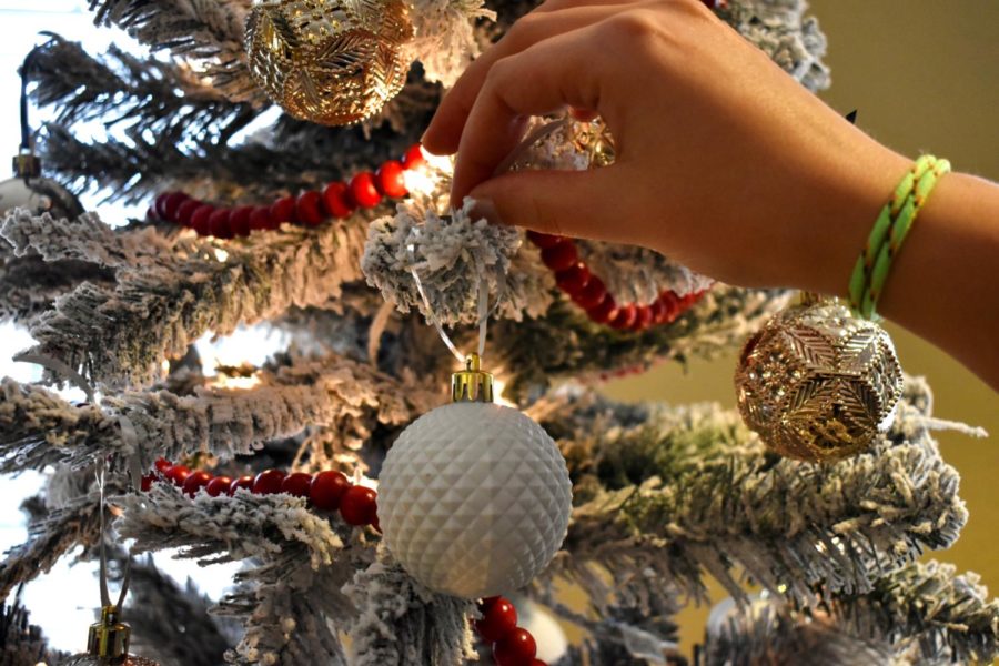 Hanging ornaments on the Christmas tree can spark fond memories for many people as the merry season arrives.