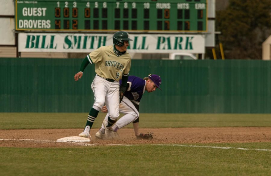 After quickly making it to third base, 	Gabriel Arroyo pops up with his eyes on the ball. 