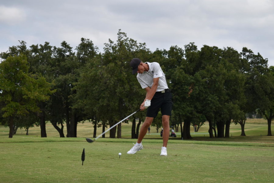 Senior Caleb Smith tees off and aims for the fairway in this round of golf. 