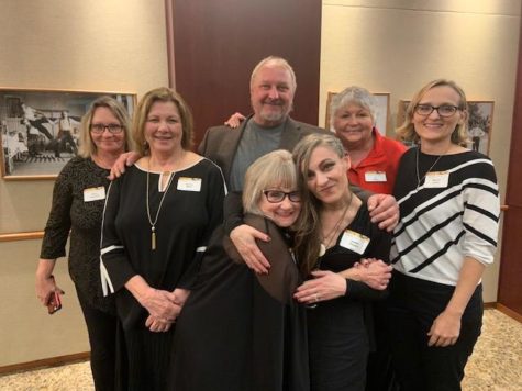 In the midst of a hug, Diane Carroll is surrounded by her friends, Donna Miles, Karen Holcomb, Layne Thrift, Dr. J.C. Casey. Dr. Rachel Jones, and Jordan Vinyard who attended the 2023 Spring DaVinci Awards Celebration. The ceremony honored Carroll and President Feaver for their contributions to higher education. 