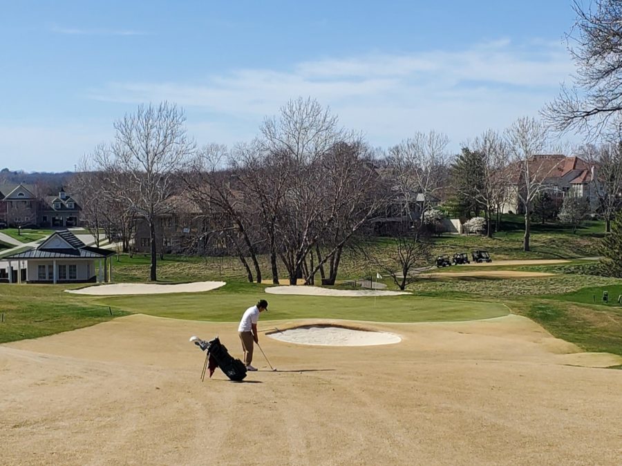 Conner Cryer hits his approach shot on the fifth hole during a tournament this spring. 