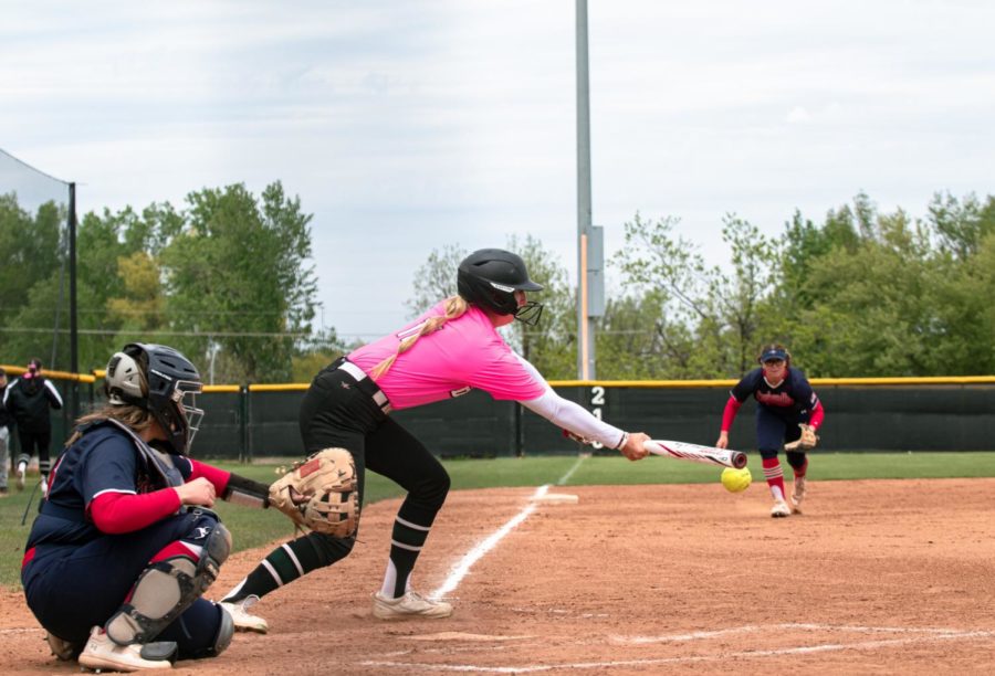 Jaylee Willis, USAOs centerfielder, sticks her bat out for a bunt while OPSUs third basemen prepares to make the play. 