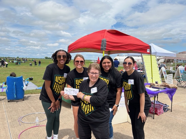 Students (left to right) Lariah Allen, Jamie Townley, Nataly Gonzalez, Amanda Trenzo and Dr. Linda McElroy (center), hold a Relay Card for Howie Jackson, a Chickasha resident who was the guest speaker and named the group’s “Hero of Hope.”