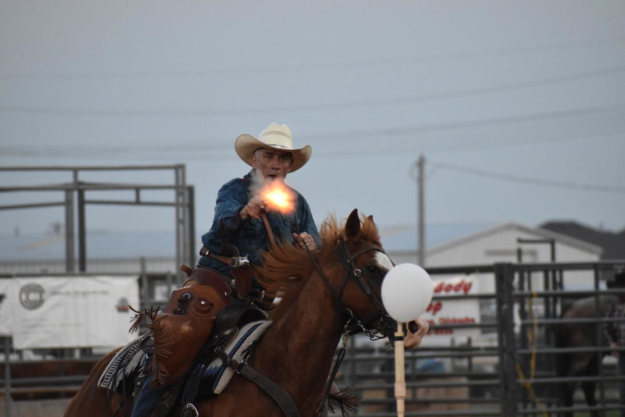 A+man+fires+at+the+first+balloon+while+mounted+upon+his+horse+at+the+Chickasha+Rodeo.+