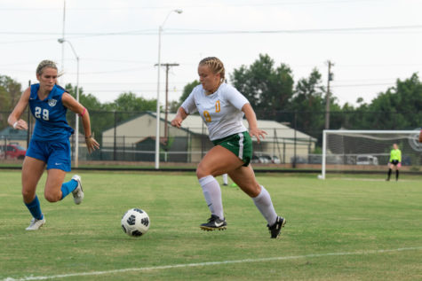 In her last season as a Drover, Emma Rice looked to out maneuver an opponent on her home field.