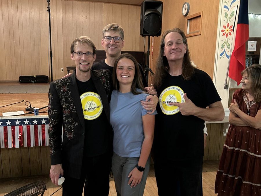 Emily Loughridge (center) takes a moment to thank Kyle Dillingham (left) and the Horseshoe Road Band, including Peter Markes and Brent Saulsbury, after their event at the Czech Hall in Yukon.