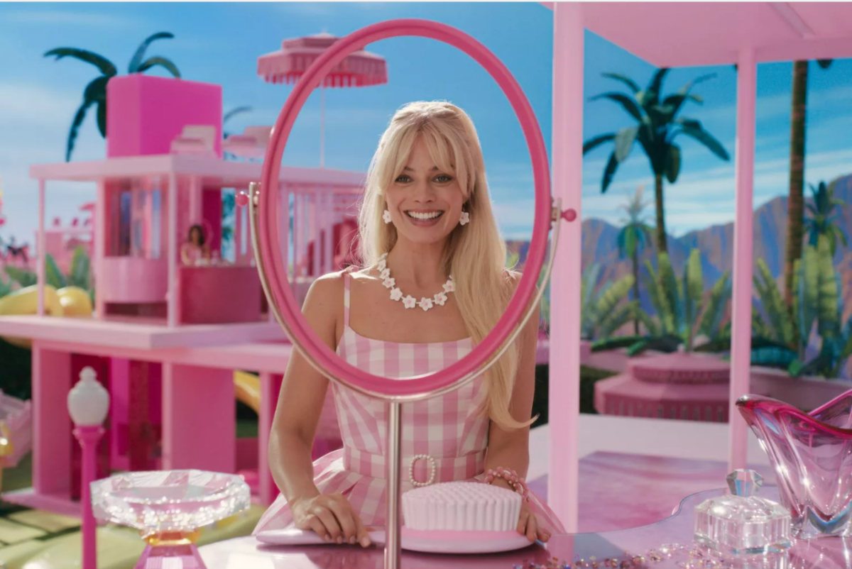 Barbie%2C+played+by+Margo+Robbie%2C+showcases+one+of+her+many+pink+outfits+in+this+scene+in+the+2023+Barbie+movie.+