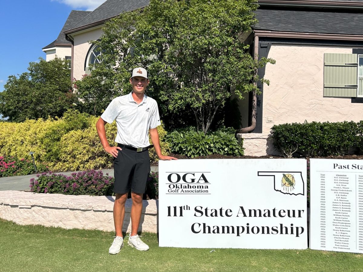 After winning his first two rounds in day one of the Oklahoma State Amateur tournament at Southern Hills Country Club, Caleb Smith takes a moment to enjoy his accomplishment. 