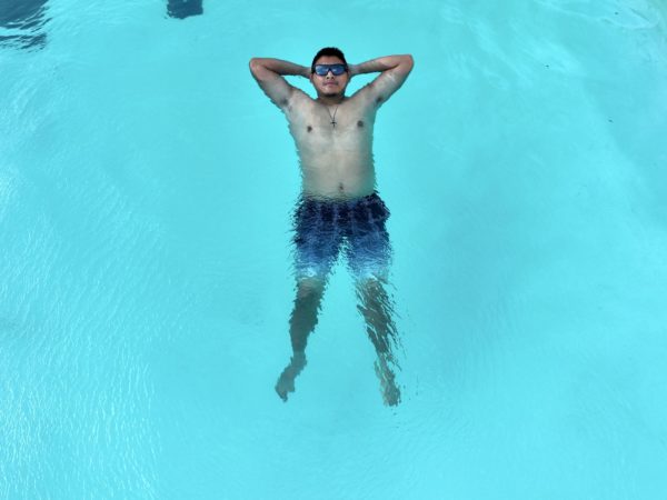 Paul Tointigh overcame his fear of swimming, and now cooly floats in the Lawson Clubhouse pool in early August.