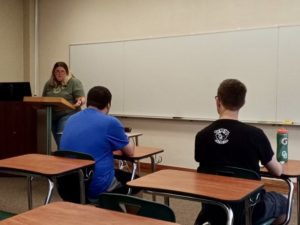 Cynthia Fuston lectures during her Business Law I class, while students Dakota Martinez (left) and Jordan Leslie listen attentively. 