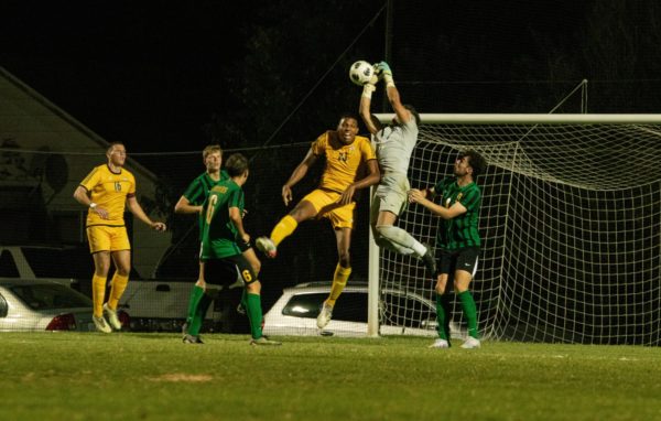 Angel Diaz jumps higher than the Ottawa player to catch the ball before it can reach USAOs goal. 