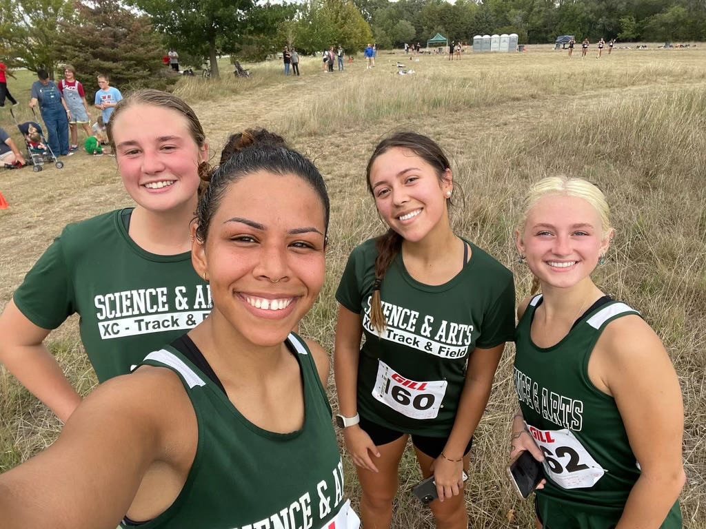 USAOs womens team is all smiles after their 5K event in Kansas, including (from left) Chelsea Fuston, Laura Barrios Bardi, Trinity Albao-Cozad, and Savannah Creech.