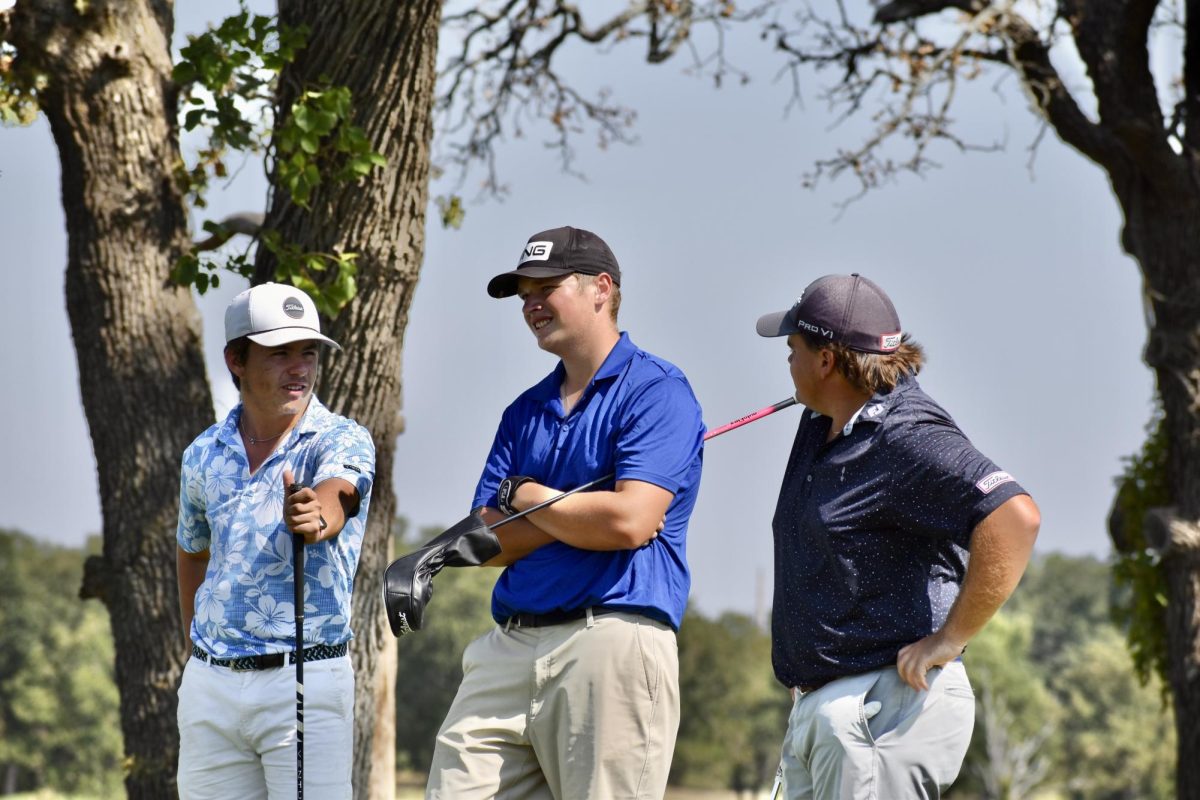 Conner Cryer, Luca Gisler, and Tucker McDonald take a minute to chat before their next shots earlier in the season. 