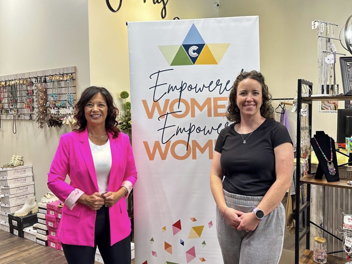 Tammie Warren (left), owner of Tammies Bling Boutique, and Whitney Palensano, Membership Director of the Chamber, stand together during a Womens Wednesday event. 