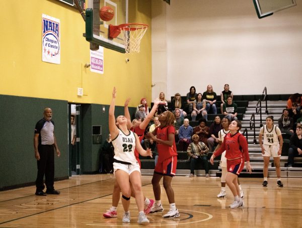 Lainey Morrow backs into her defender and successfully makes a behind-the-back layup to increase USAOs lead. 