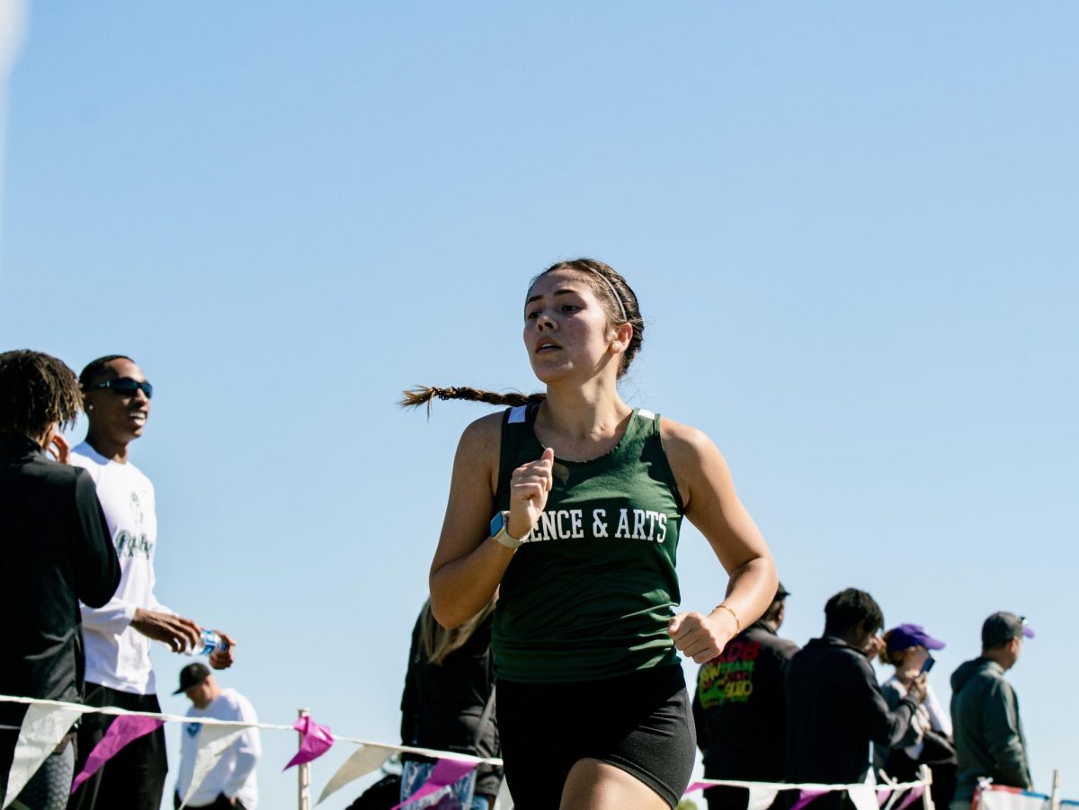 Trinity Albao-Cozad nears the finish line during a cross-country meet in her first fall season.