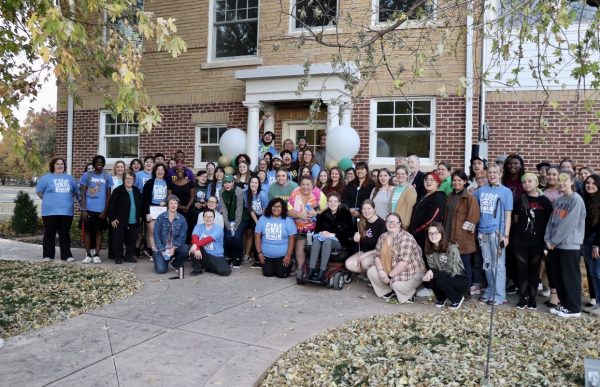 First-generation students and faculty gather on the steps of the Presidents House during a special Pizza on the Patio event last week.