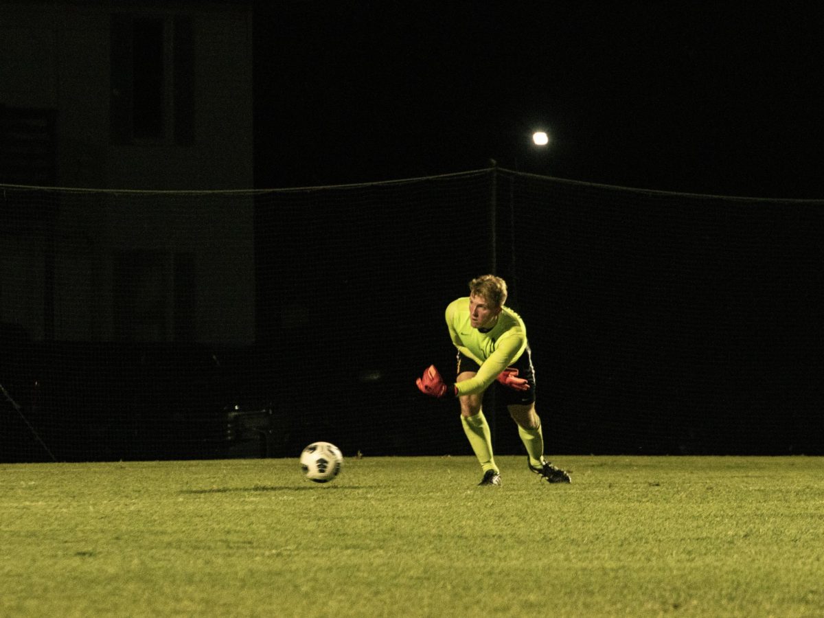 Goalie Harry Cracknell rolls the ball to a teammate in a night game against SCU.