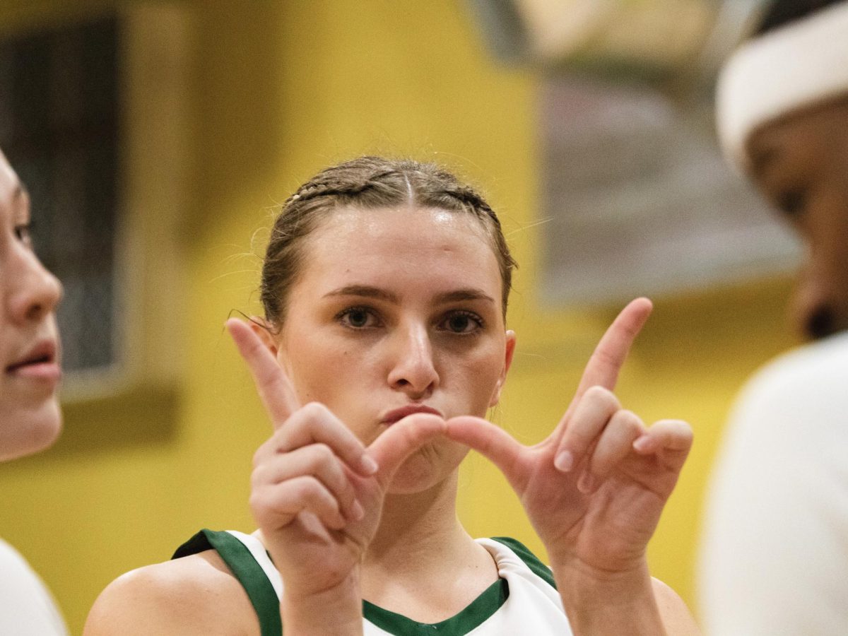 Lainey Morrow throws up a W after the Drovers secrued the win over the Stars Thursday night.