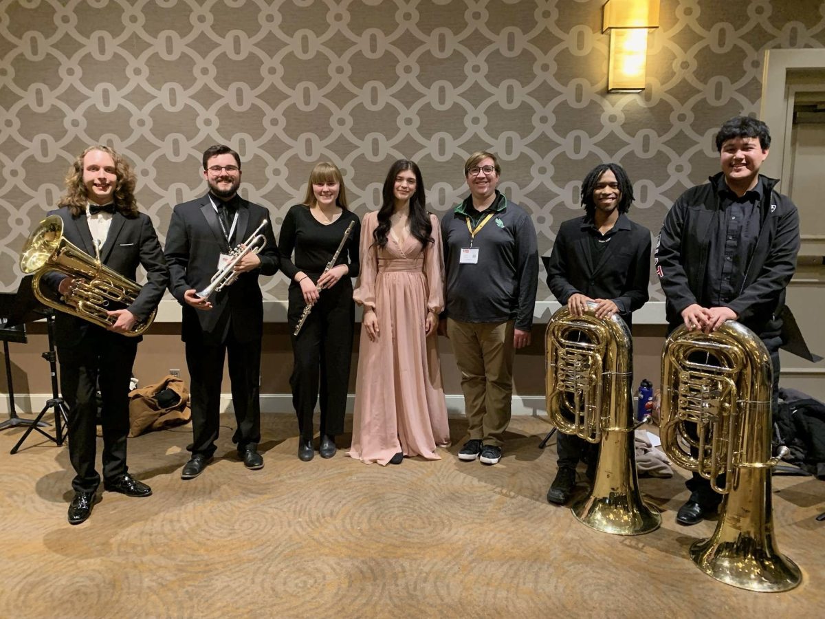 USAOs Concert Band, including (from left) Thomas Buchanan, Tyler Sweeden, Jaden Johnston, Lydia Wills, Kaleb Benda, Isaiah Young, and David Orgas, prepares for their performance.