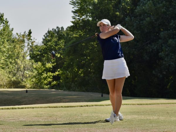 Sophomore Hudson Woloss uses her driver to tee off at the teams home course in Blanchard, Oklahoma.