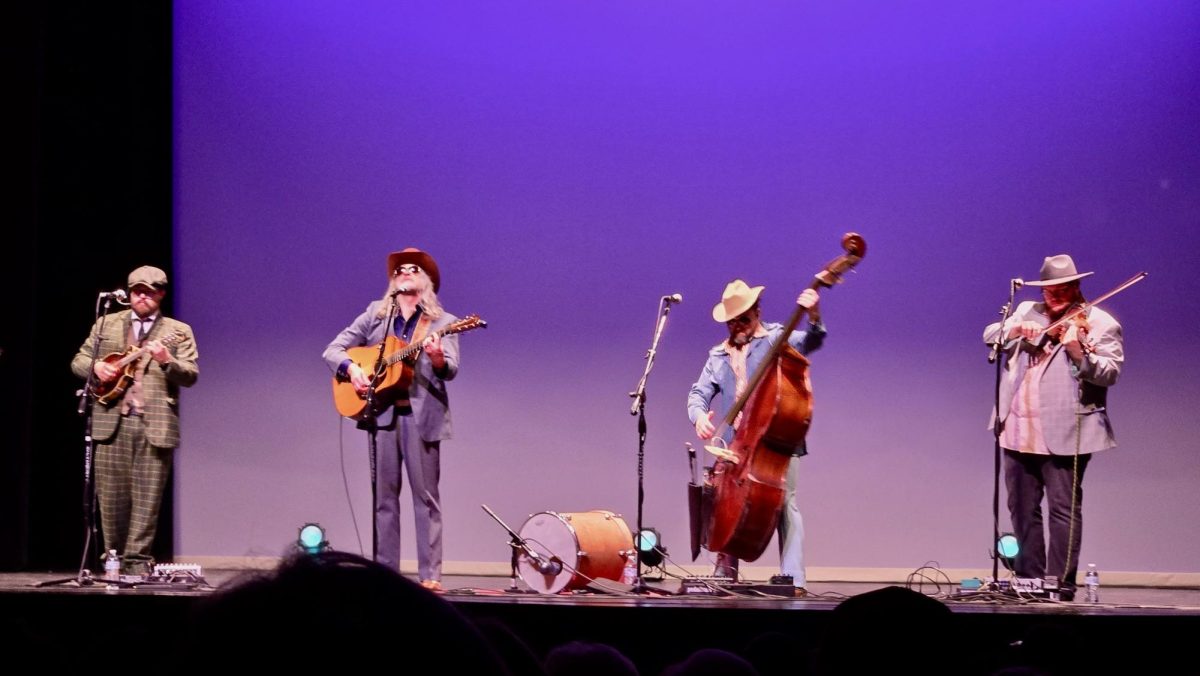The Cleverlys string bass player (second from the right) strums heavily on his featured riff in their bluegrass version of Creep by Radiohead. 