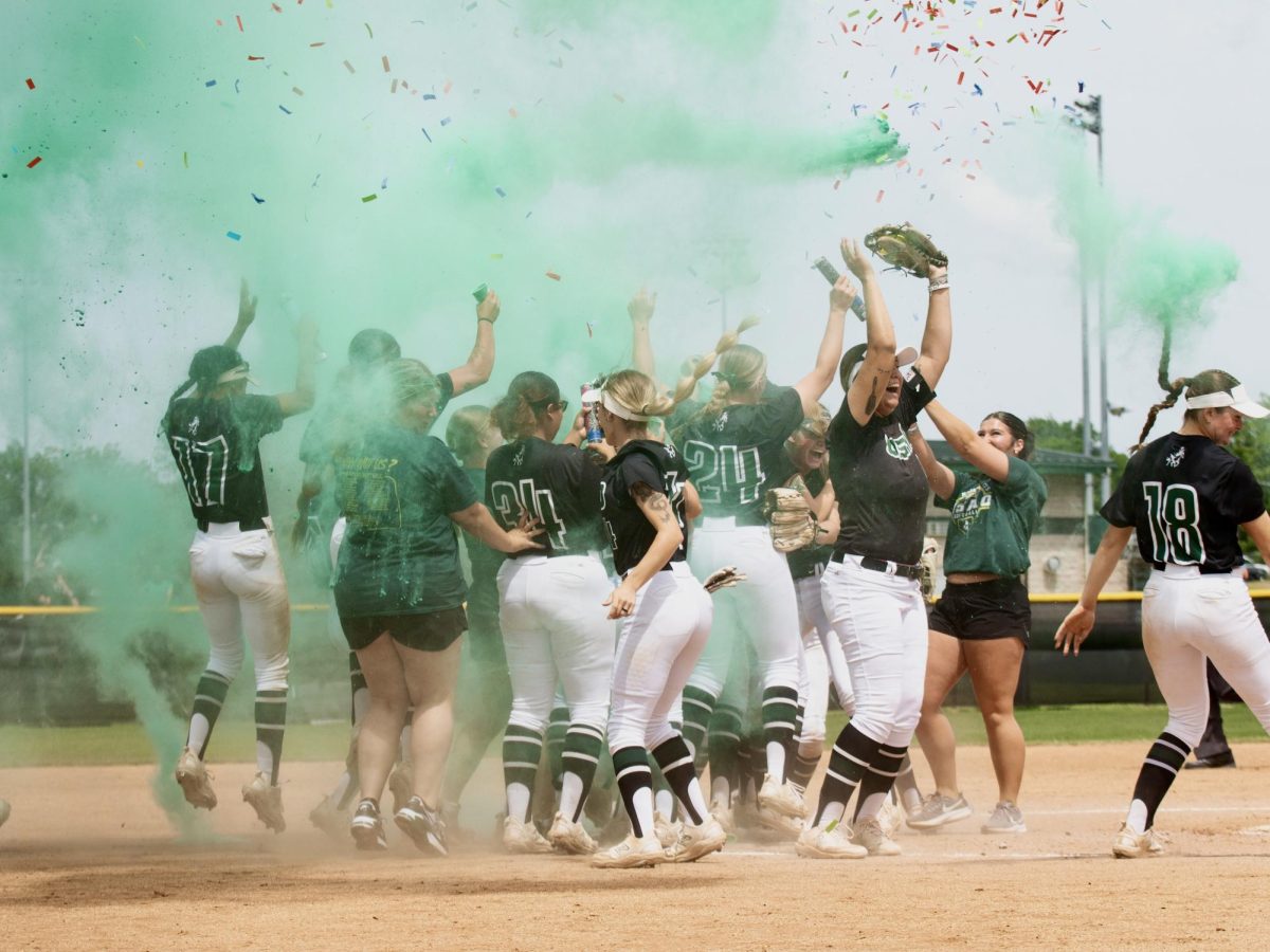 The Drovers celebrate in a cloud of green smoke and confetti after winning the opening round and punching their ticket to Georgia. 