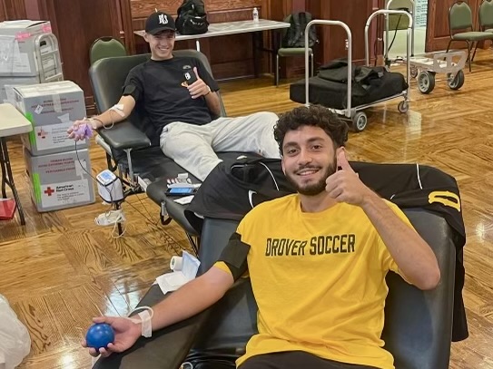 Loris Mariotti (front) and Sebastian Boldt supported RCC in a previous blood drive held in the ballroom. 
