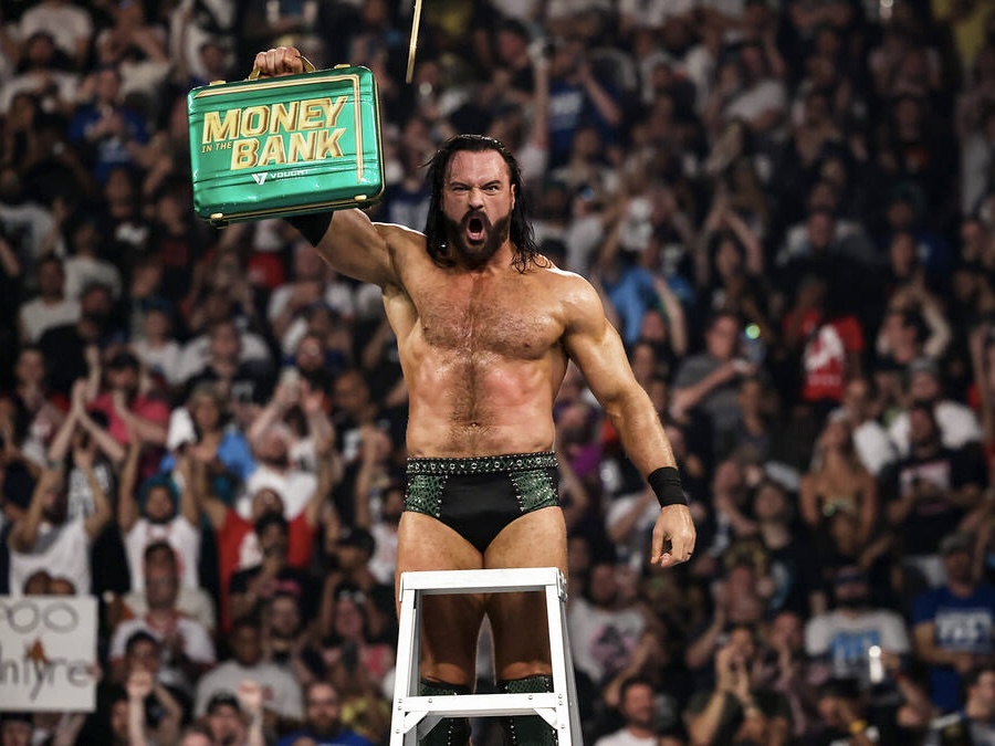 Drew McIntyre presented his briefcase to the crowd after winning the Mens Money in the Bank ladder match.