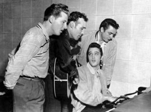 Elvis Presley, Carl Perkins, Jerry Lee Lewis, and Johnny Cash recording at Sun Studios.