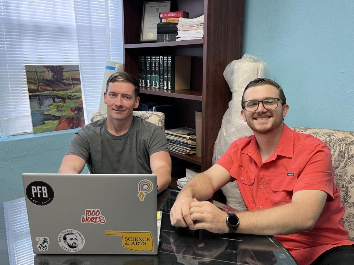 Co-Editor in Chief Kyle Cox (left) and Co-Editor in Chief Sean Tourtelotte (right) smile for the camera.