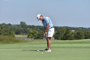 During a practice round at Winter Creek Golf and Country Club, Conner Cryer putts towards the hole. 