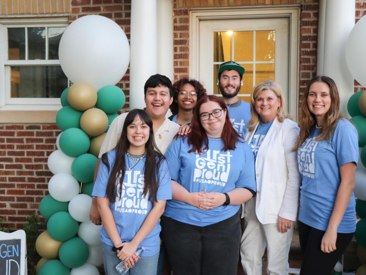 Multiple first-generation USAO students with President Hale during last year's Pizza on the Patio event. 