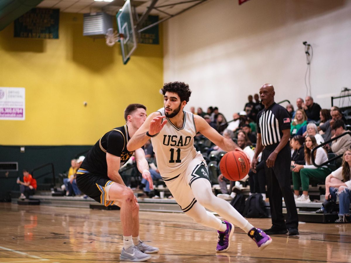 Junior Mohand Ammed evades past a Texas Wesleyan University defender in their game earlier this season. 