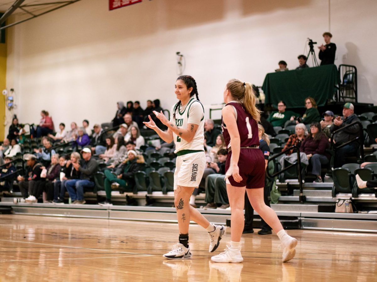 Senior Alexia Corrales claps her hands together after beating the College of the Ozarks earlier this season. 