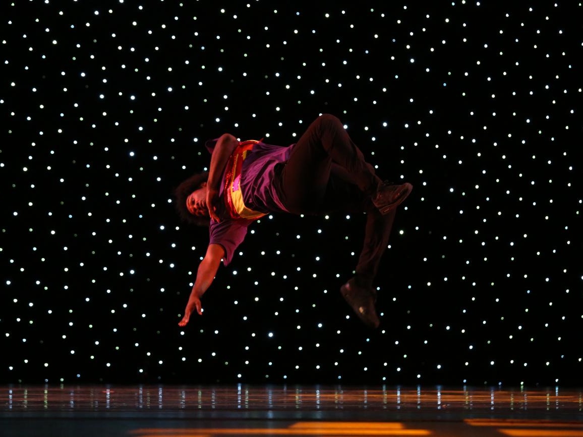 One of the FLY Dancing Company's dancers performing his signature moves. 