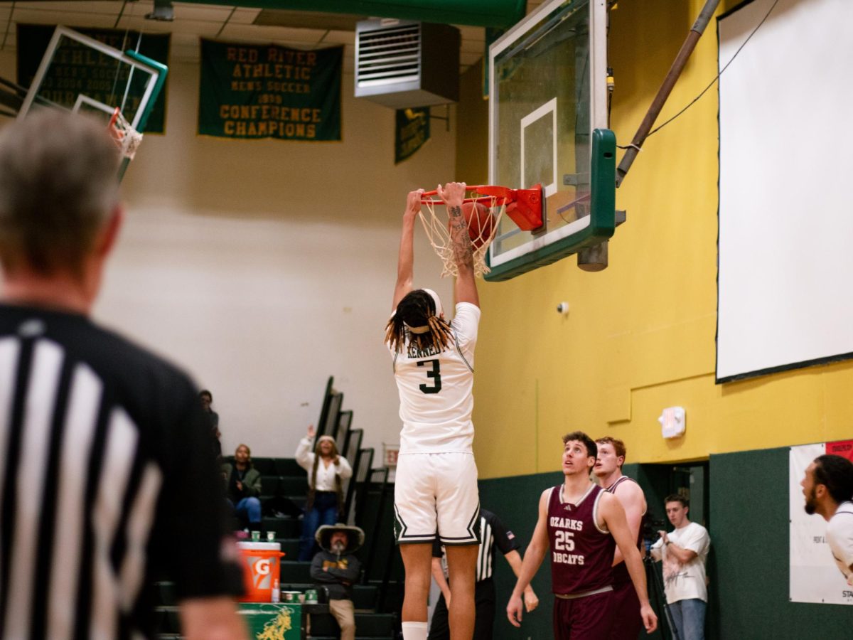 Sophomore Ryein Kennedy hits a dunk during the game against College of the Ozarks earlier this season. 