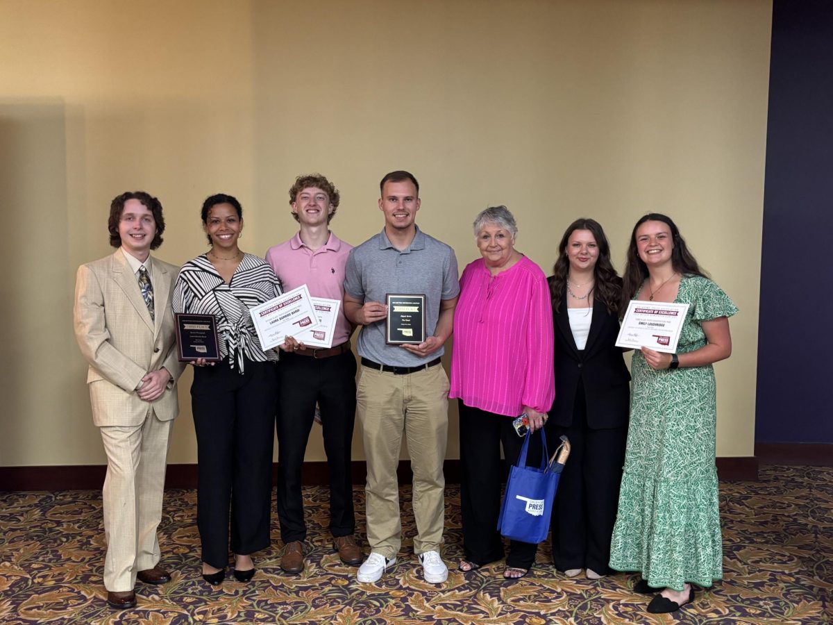 Representatives of The Trend pose with the awards won at the 2025 OPA Better Newspaper Contest.

From Left: Thomas Buchanan, Laura Barrios Bardi, Matthew Yokum, Gary Jackson, Dr. J.C. Casey, Cassie Srock, and Emily Loughridge. 